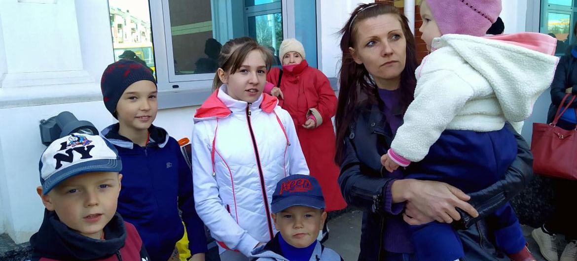 Olena and her five children wait for an evacuation train at the train station in Kramatorsk, Donetsk region of Ukraine.