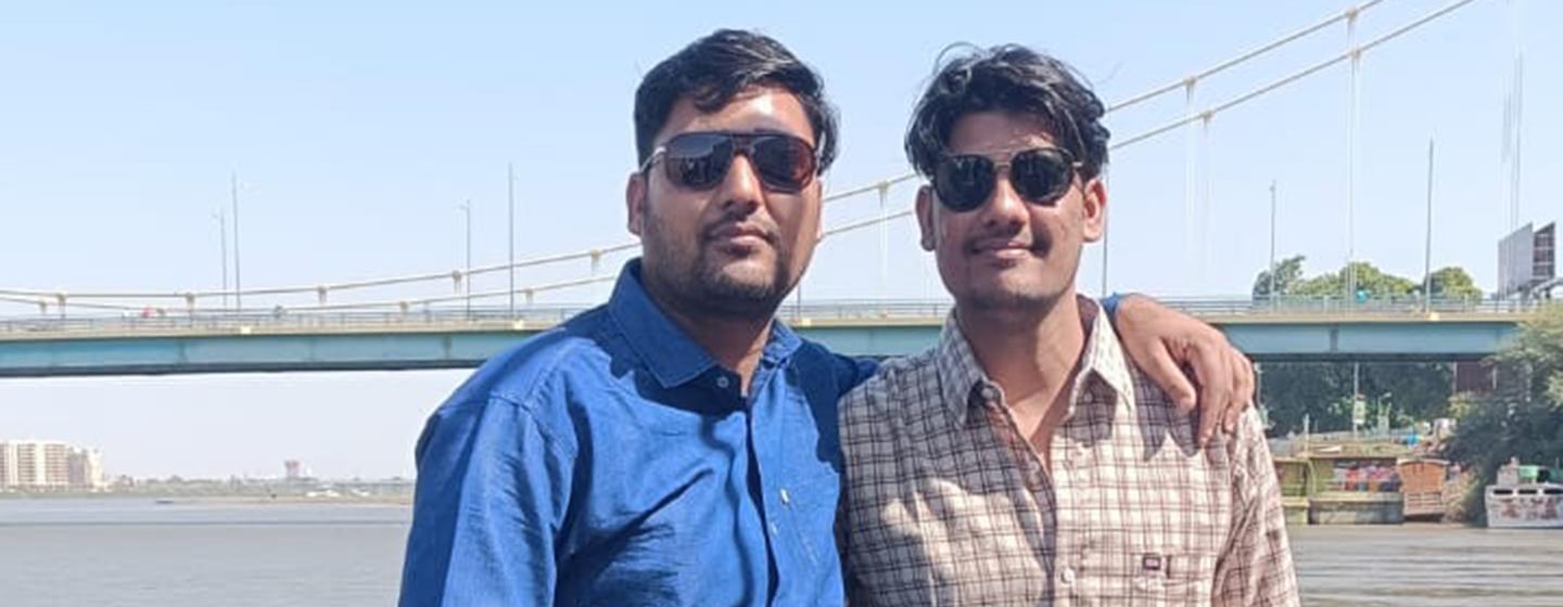 In happier times, Raghuveer Sharma with his brother visited the River Nile. In the background is a bridge that he said is now "completely destroyed".