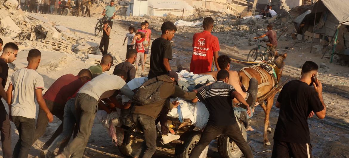 A horse-drawn cart carries the bodies of more than seven Palestinians killed while trying to reach aid. A horse-drawn cart carries the bodies of more than seven Palestinians killed while trying to reach aid.