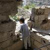 A boy looks out from his home in the volatile area of Al Gamalia in Taiz, Yemen. (file)