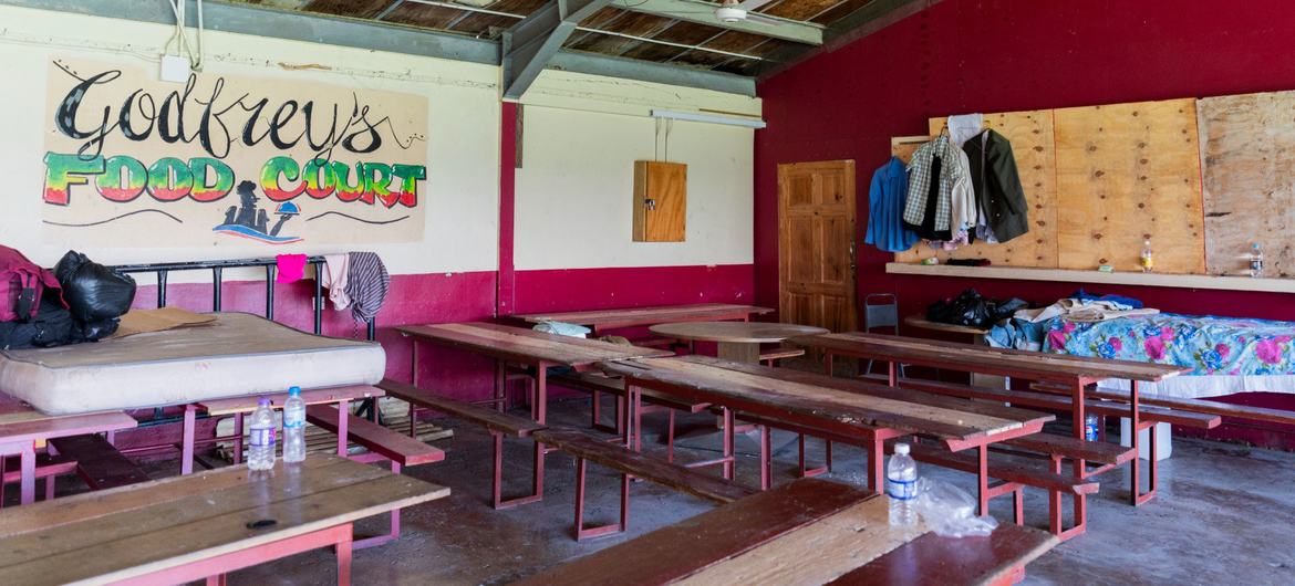 A school serves a temporary shelter for people whose lives were upended by Hurricane Melissa.