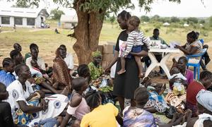 A group of mothers in Uganda discuss the benefits of the UN agency-supported Nutricash project which helps improve nutrition for families in need.