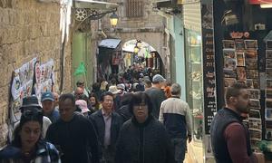 People walk through Jerusalem's Old City.