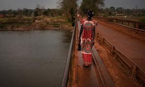 A woman crosses a bridge in Bambari, in the Central African Republic.