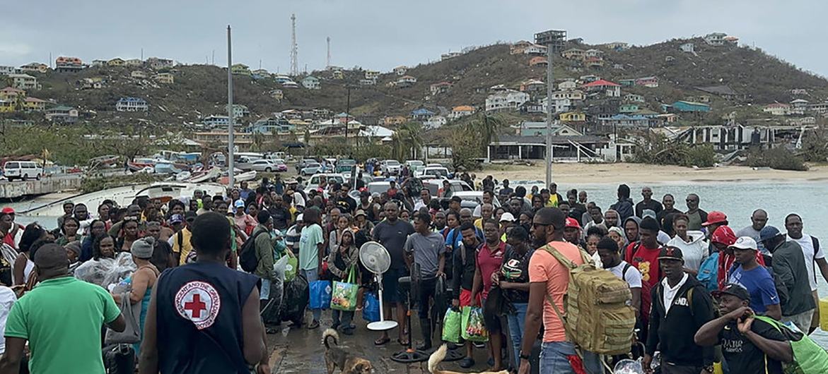 Residents of Union Island in Saint Vincent and the Grenadines prepare to board a ferry to reach shelter in the wake of Hurricane Beryl.