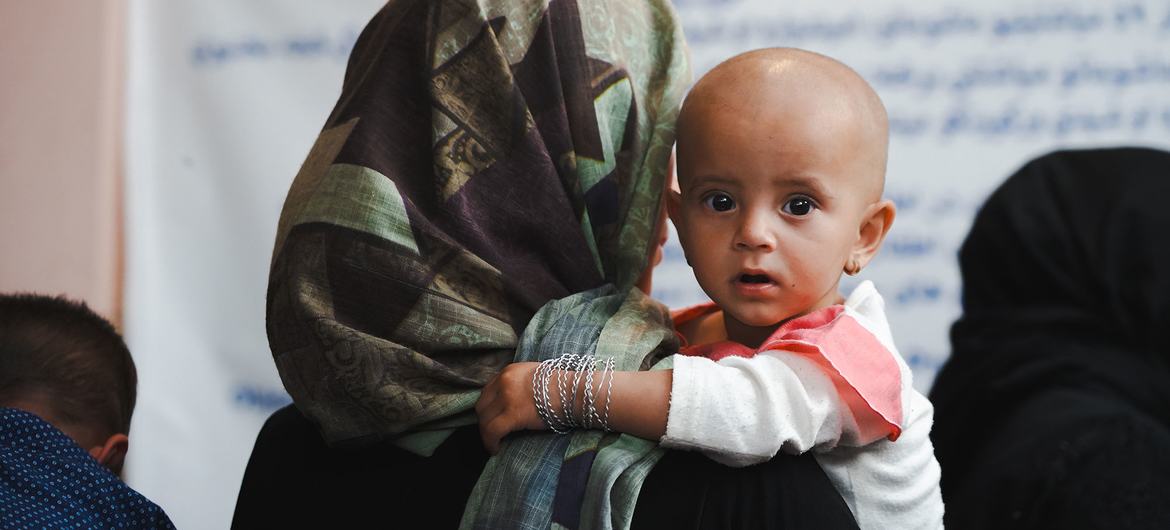 A mothers brings her malnourished daughter to a nutrition clinic in Kabul, Afghanistan.