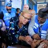 Sigrid Kaag, Senior Coordinator for Humanitarian Affairs and Reconstruction in Gaza, administers a dose of the polio vaccine to a child in Gaza.