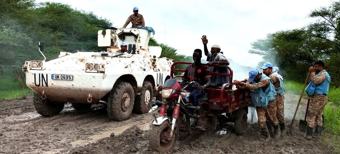 Peacekeepers help to recover bogged down vehicles and rescue stranded civilians following heavy rains.