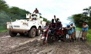 Peacekeepers help to recover bogged down vehicles and rescue stranded civilians following heavy rains.