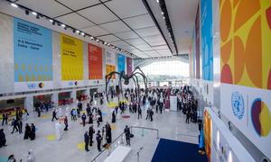 Participants at the World Summit in the "Spider" foyer of the Qatar National Convention Centre.
