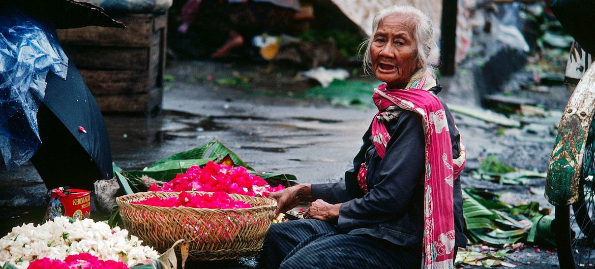 An elderly flower vendor in Jogyakarta, Indonesia. According to UN estimates, 58 per cent of world's older persons live in Asia and the Pacific, a figure expected to rise in the years to come. An elderly flower vendor in Jogyakarta, Indonesia. According to UN estimates, 58 per cent of world's older persons live in Asia and the Pacific, a figure expected to rise in the years to come.