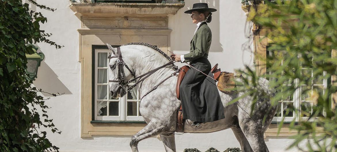 Female horse rider in Golegã dressed in Portuguese style.