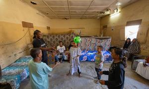 Ishmael Beah visits children at a UNICEF-supported child-friendly space in Port Sudan.