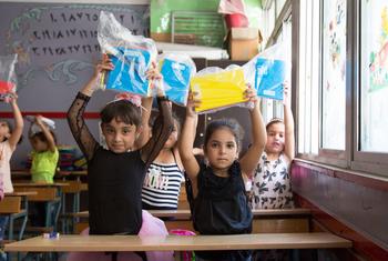Palestinian children receive stationery items at an UNRWA school in south Lebanon.