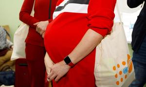 A pregnant Ukranian woman who left Odessa with her mother and young son receives a dignity kit at a placement centre in Moldova's capital city, Chișinău (file).