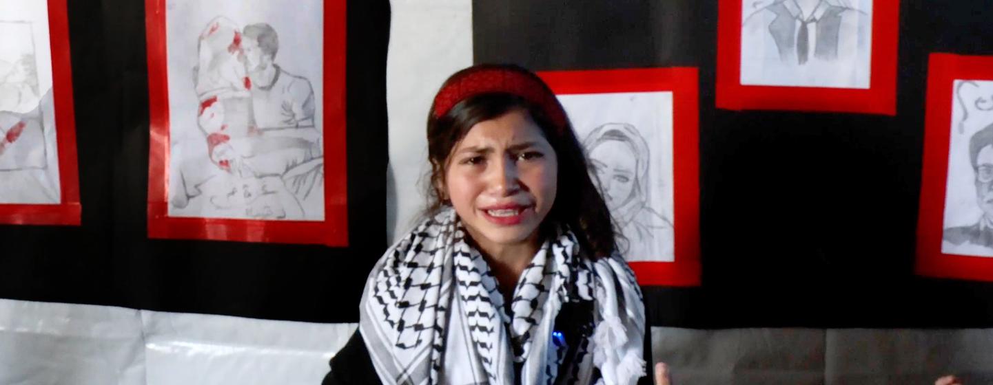 Fatima Al-Za’anin, a displaced Palestinian girl from Beit Hanoun (Gaza), speaks about her drawings in an art exhibition organized by UNRWA in Gaza City as part of its mental health and psychosocial support services. Fatima Al-Za’anin, a displaced Palestinian girl from Beit Hanoun (Gaza), speaks about her drawings in an art exhibition organized by UNRWA in Gaza City as part of its mental health and psychosocial support services.