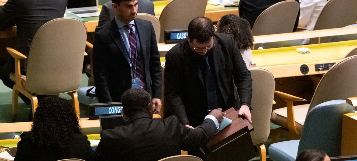 A delegate casts his country's vote to elect five new non-permanent members to the UN Security Council.