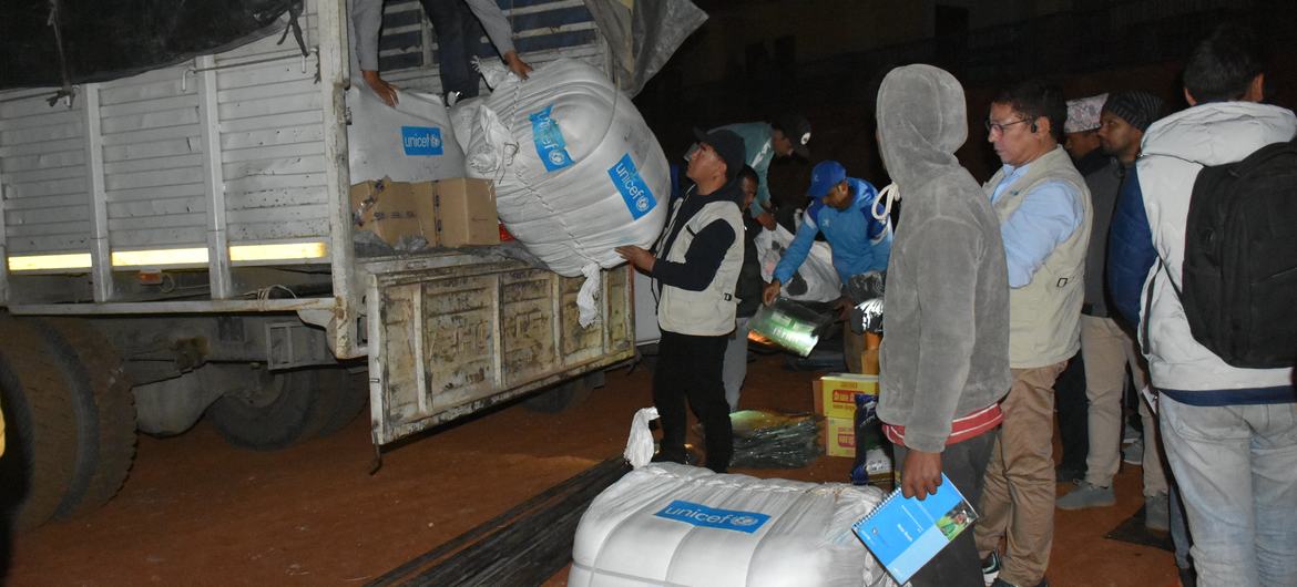 UNICEF staff unload relief supplies in the earthquake-hit Jajarkot district in western Nepal.