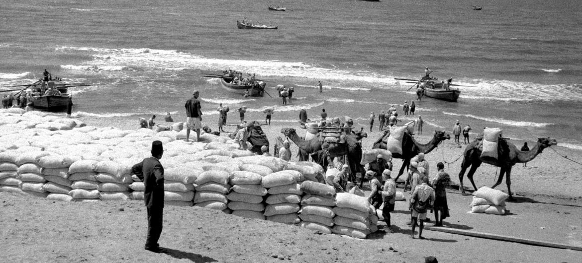 Relief aid is delivered to Gaza by ship in 1957.