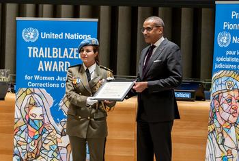 Major Ahlem Douzi is presented with the United Nations Trailblazer Award by Chef de Cabinet Courtenay Rattray at a special ceremony.