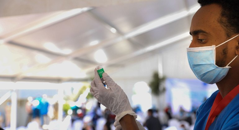 A health worker prepares a COVID-19 vaccine in Ethiopia.
