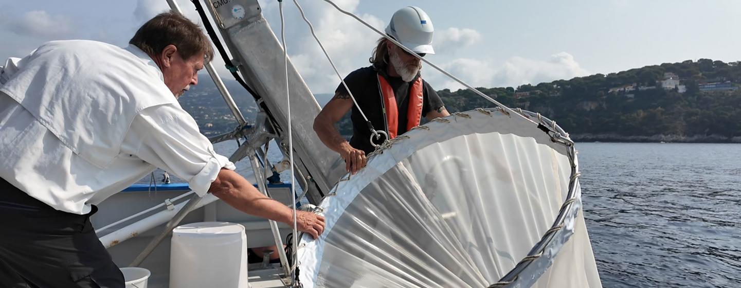 Jean-Yves Carval (left), captain of the Sagitta III, and his chief mechanic, Christophe Kieger, fish zooplankton with a special net.