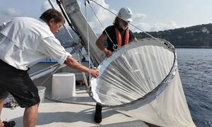 Jean-Yves Carval (left), captain of the Sagitta III, and his chief mechanic, Christophe Kieger, fish zooplankton with a special net.