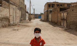 A boy stands in a disadvantaged neighbourhood of Ahvaz, Iran.