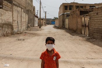 A boy stands in a disadvantaged neighbourhood of Ahvaz, Iran.