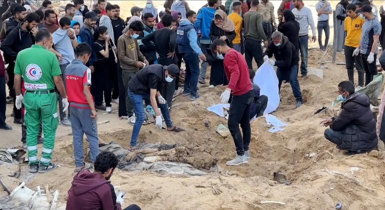 Palestinians bury ambulance employees killed by Israeli forces.