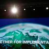 A video screen in the main COP27 plenary room displays the official slogan of the Egyptian Presidency: ‘Together for Implementation’.