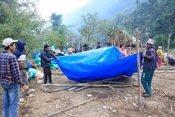 An earthquake affected community in Rukum (West), Nepal, setting up a tent.