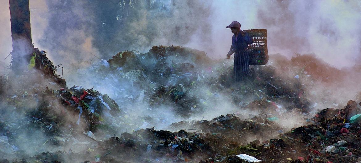 A girl scavenges for recyclable materials at a garbage dump in Mandalay, Myanmar's second-largest city, where impoverished families are often forced to search for items to sell for minimal income. (file)