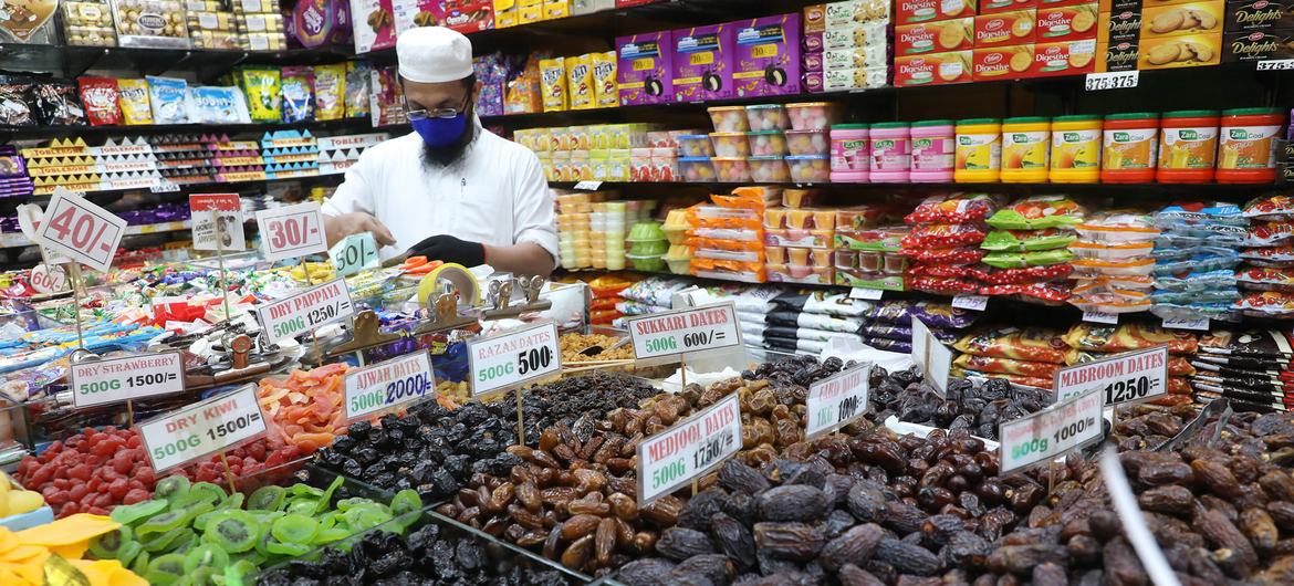 A Sri Lankan shop keeper arranges sweets prior to Ramadan celebrations. 