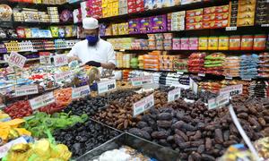 A Sri Lankan shop keeper arranges sweets prior to Ramadan celebrations. 