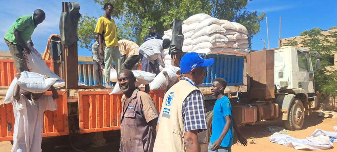WFP delivers food to families in south Khartoum, Sudan, after a convoy reached the area in late December for the first time since conflict broke out.