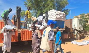 WFP delivers food to families in south Khartoum, Sudan, after a convoy reached the area in late December for the first time since conflict broke out.