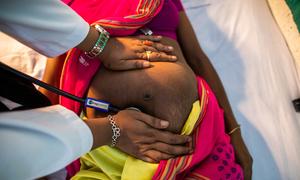 A pregnant woman has a prenatal check-up at a hospital in Muttuck, India.