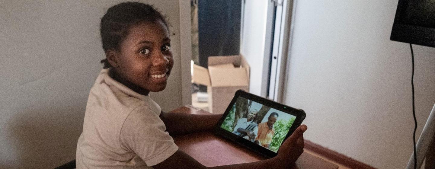 A young girl accesses digital tools in a classroom in southern Madagascar.