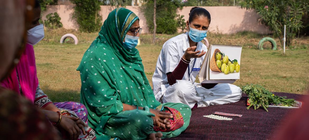 A nurse speaks to women about nutritious food in western India's Sabarkantha district, were many women and girls suffer from iron deficiency. A nurse speaks to women about nutritious food in western India's Sabarkantha district, were many women and girls suffer from iron deficiency.