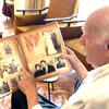 Mahmoud Al-Said goes through some of his family photos gathered over 76 years of refuge in Lebanon. 