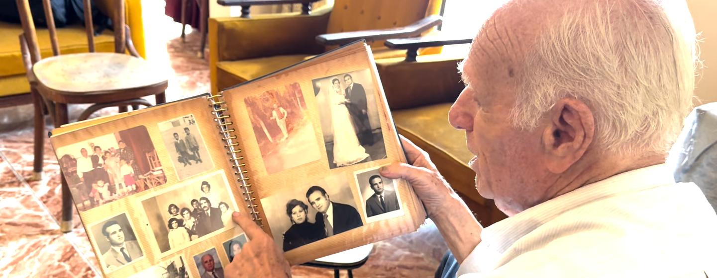 Mahmoud Al-Said goes through some of his family photos gathered over 76 years of refuge in Lebanon. 