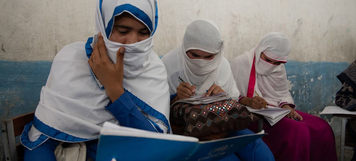 Young women who fled Afghanistan study in Pakistan. 