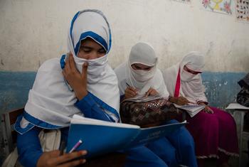 Young women who fled Afghanistan study in Pakistan. 