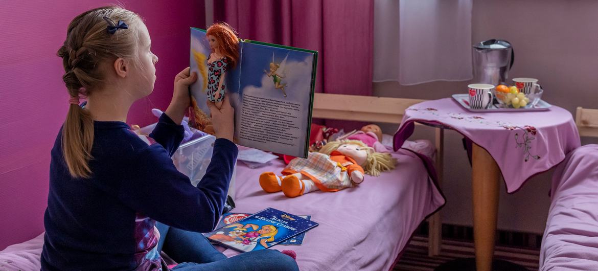 A young girl from Ukraine plays at her temporary home at the Kapelanka hostel in Poland. By the end of 2022, the number of school-aged refugees globally jumped nearly 50 per cent. 