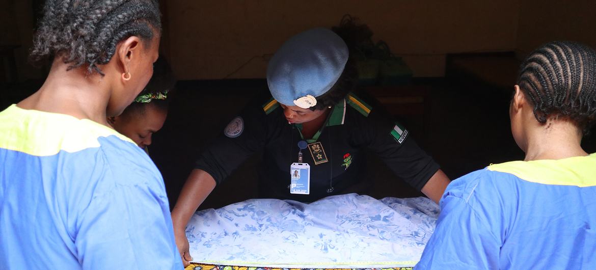 Olukemi Ibikunle (center) organizes a tailoring workshop to support the reintegration of female detainees in eastern Democratic Republic of the Congo (DRC). Olukemi Ibikunle (center) organizes a tailoring workshop to support the reintegration of female detainees in eastern Democratic Republic of the Congo (DRC).
