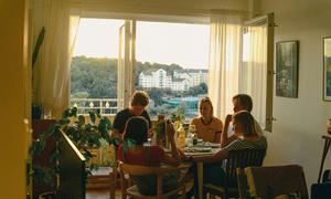 A family in Sweden enjoys a meal at home.