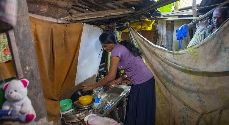 Minabige, 49, lives with her husband and daugher in a small one room shack in Sri Lanka, where they eat, cook, pray, study and sleep, inches from an open sewer.