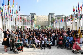 International Youth Climate Delegates (IYCD) pose for a group photo during the UN Climate Change Conference, COP28, at Expo City in Dubai, United Arab Emirates.