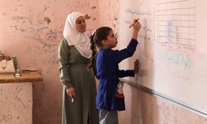 A nine-year-old girl attends a school repaired by UNCEF in rural Aleppo, which sustained significant damage during the conflict.
